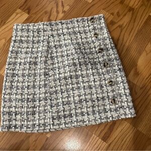 Women’s mini skirt with button detail